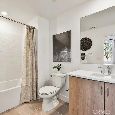 a bathroom with a toilet a sink and bathtub