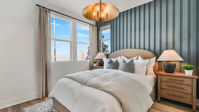 a bed room with a bed and a lamp