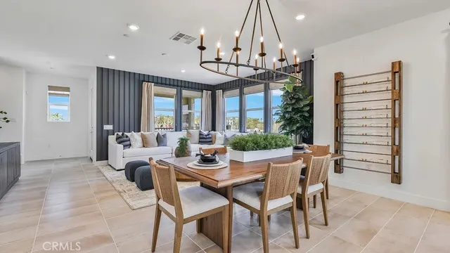 a view of a dining room with furniture wooden floor and chandelier