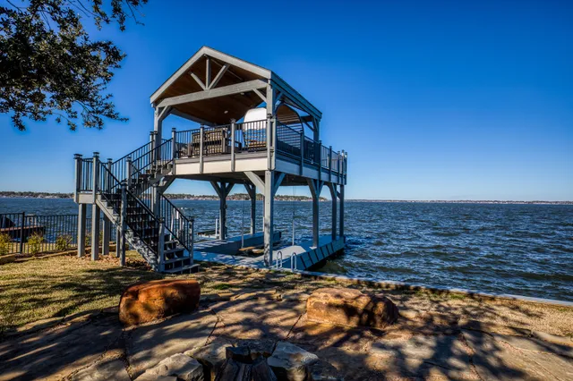 a front view of a house with parking area