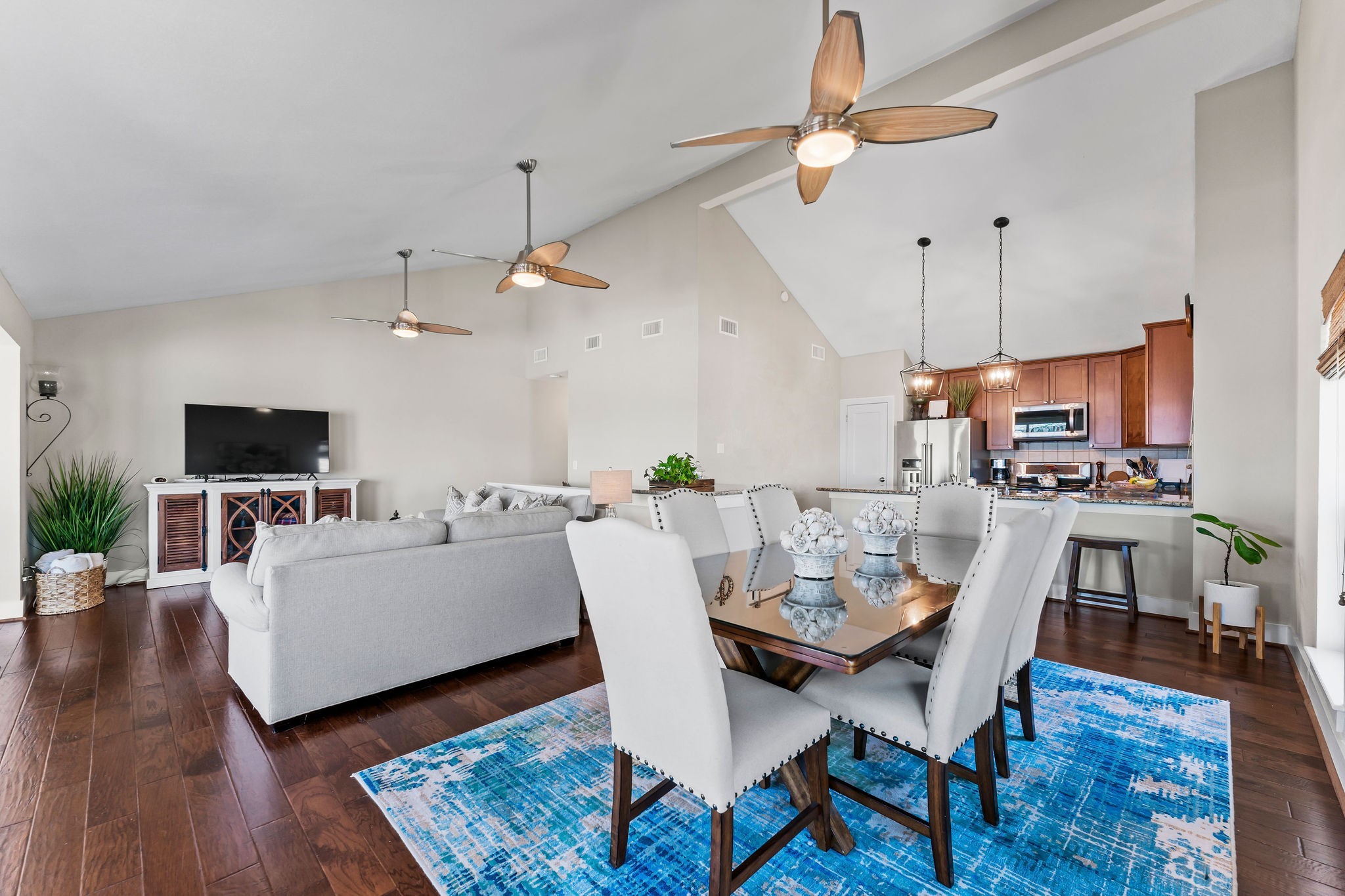 69 Lakeview Village Conroe, TX 77356 - Photo 13 of 50 a view of a dining room with furniture a rug and wooden floor