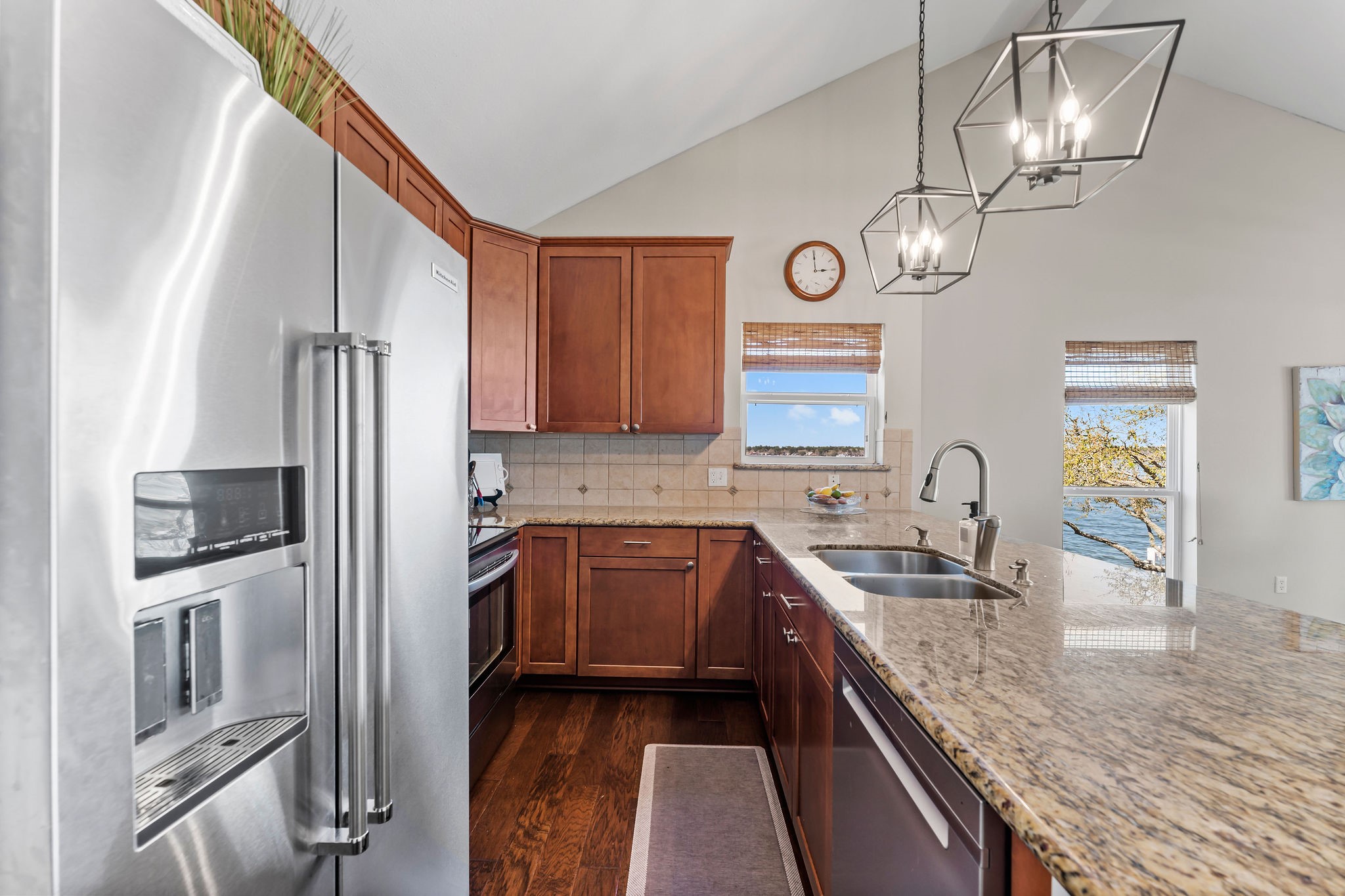 69 Lakeview Village Conroe, TX 77356 - Photo 15 of 50 a kitchen with stainless steel appliances granite countertop a sink refrigerator and microwave