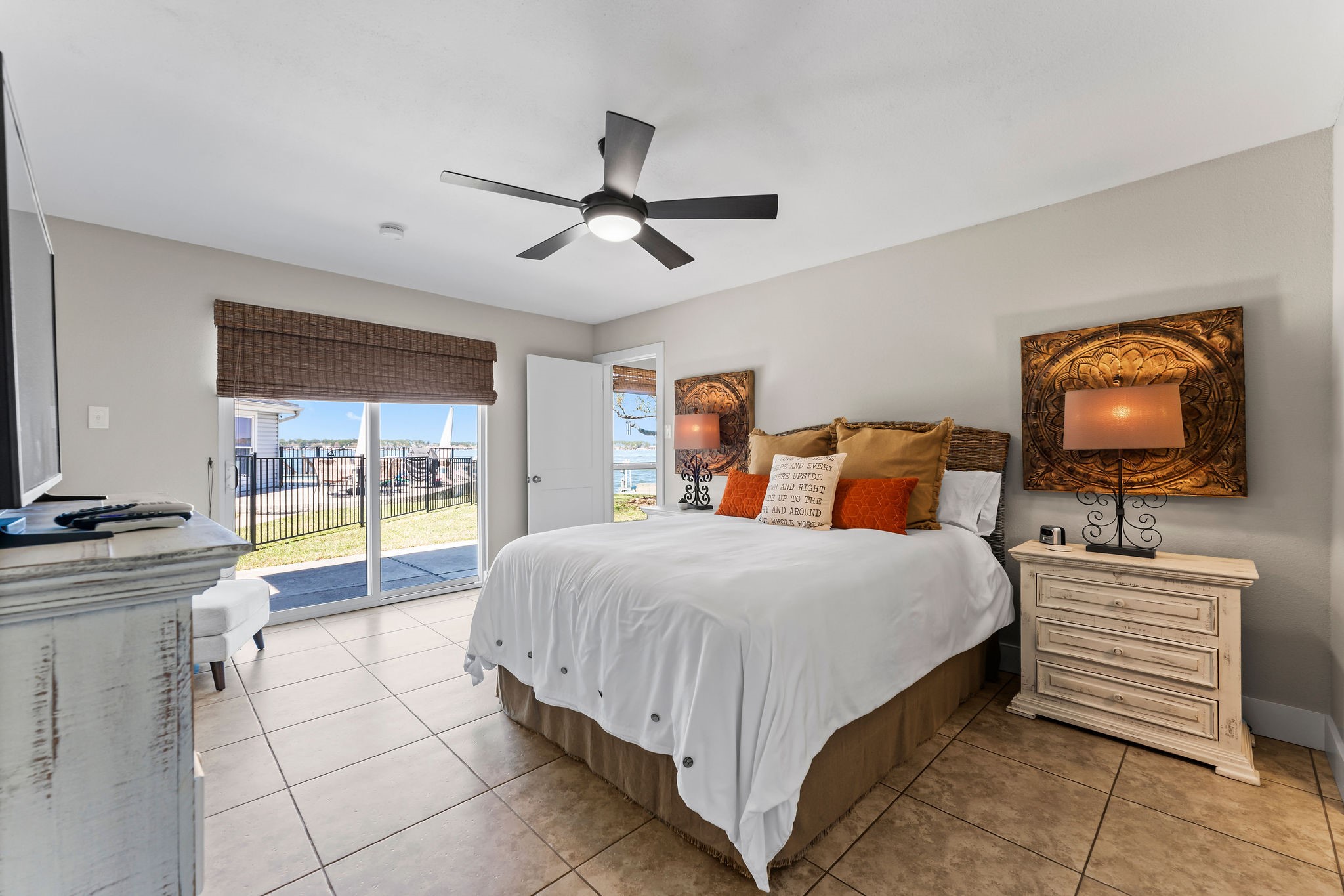 69 Lakeview Village Conroe, TX 77356 - Photo 20 of 50 a bedroom with a bed and a flat screen tv