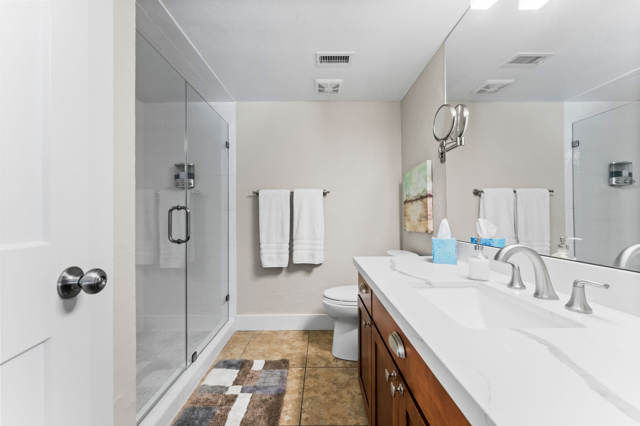 69 Lakeview Village Conroe, TX 77356 - Photo 22 of 50 a en suite bathroom with a double vanity sink a mirror and a shower