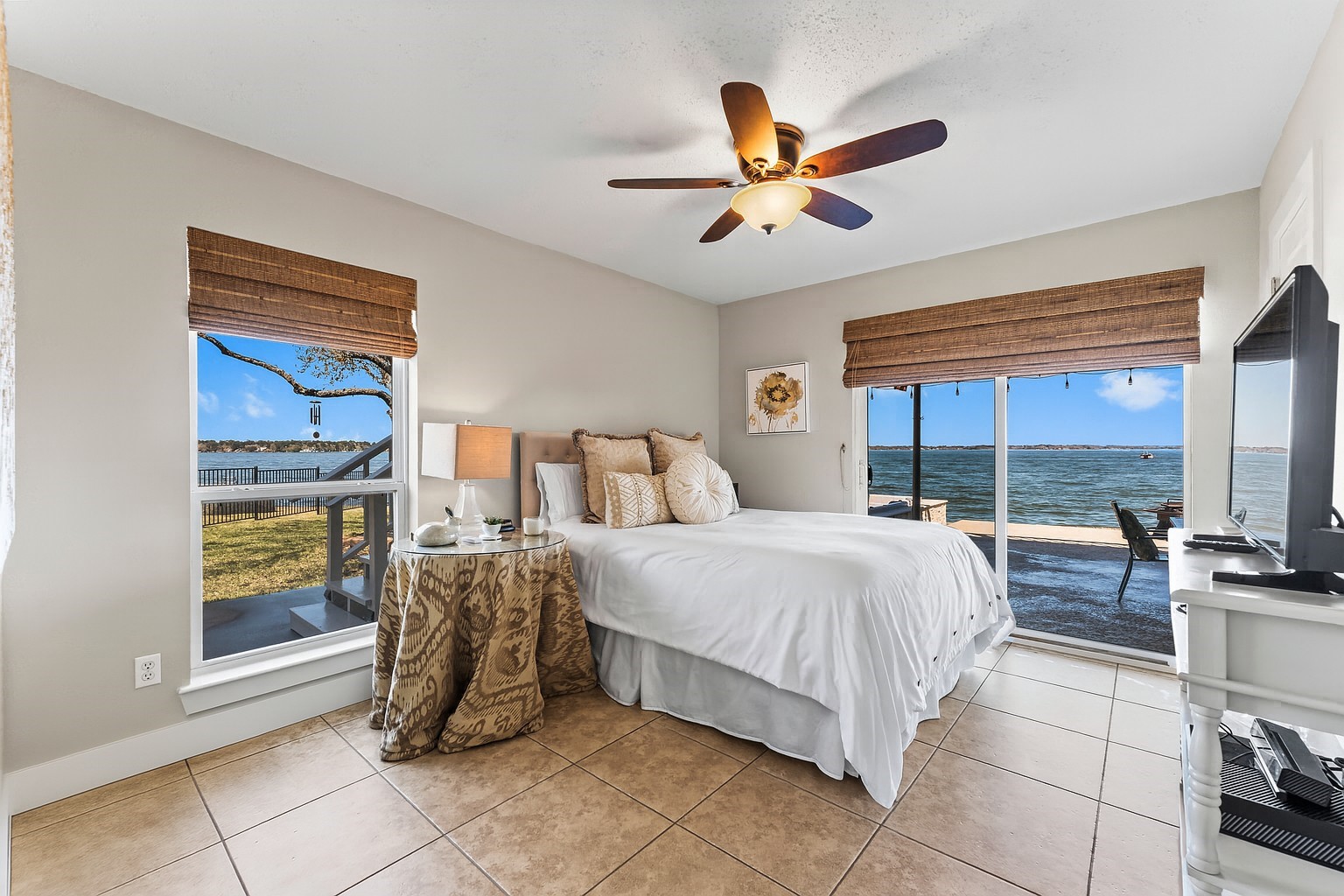 69 Lakeview Village Conroe, TX 77356 - Photo 23 of 50 a spacious bedroom with a bed and a window