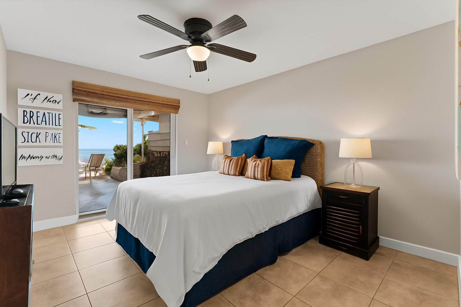 69 Lakeview Village Conroe, TX 77356 - Photo 25 of 50 a bedroom with a bed and a chandelier