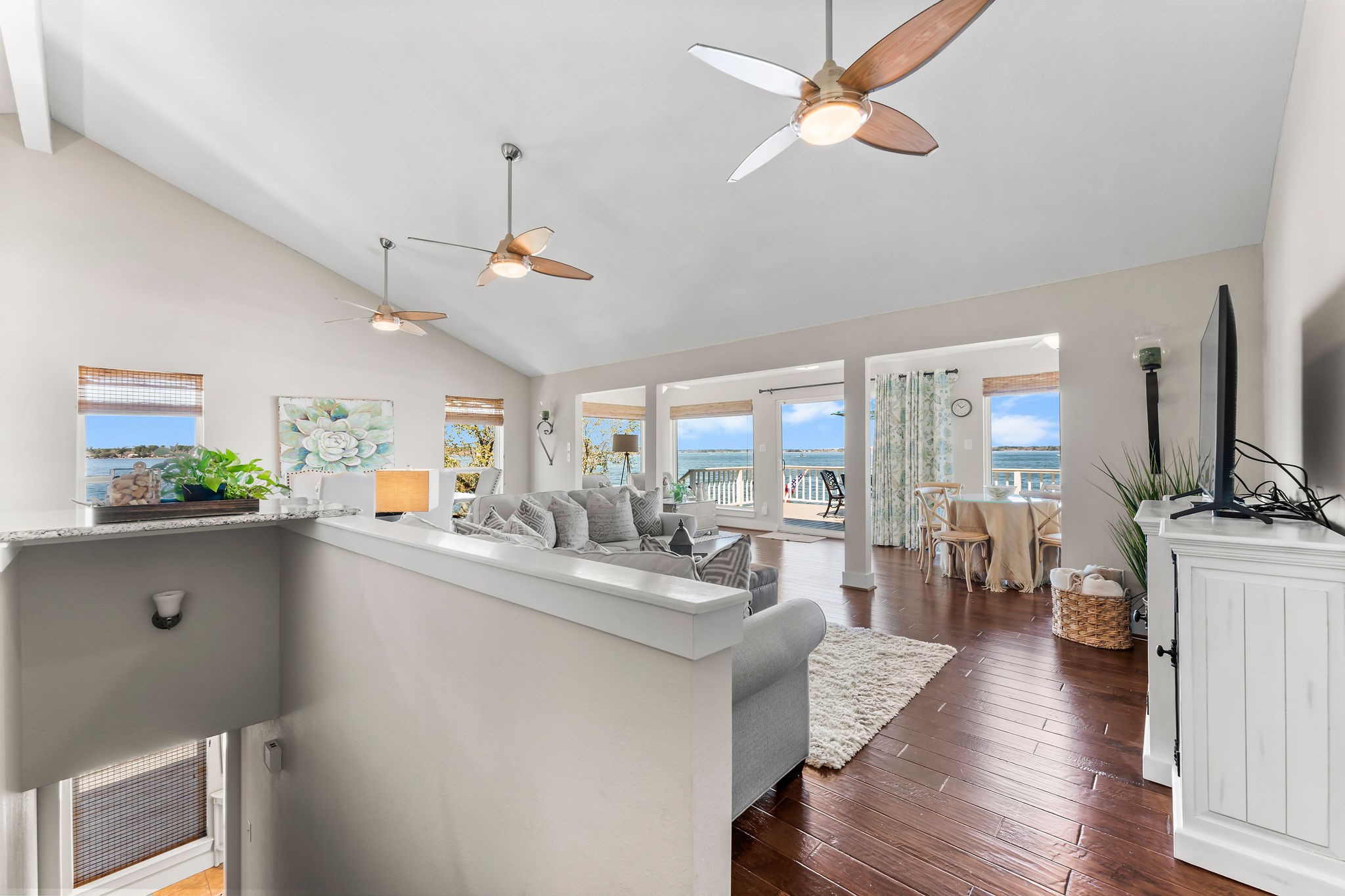 69 Lakeview Village Conroe, TX 77356 - Photo 26 of 50 a living room with stainless steel appliances furniture a chandelier and a view of kitchen