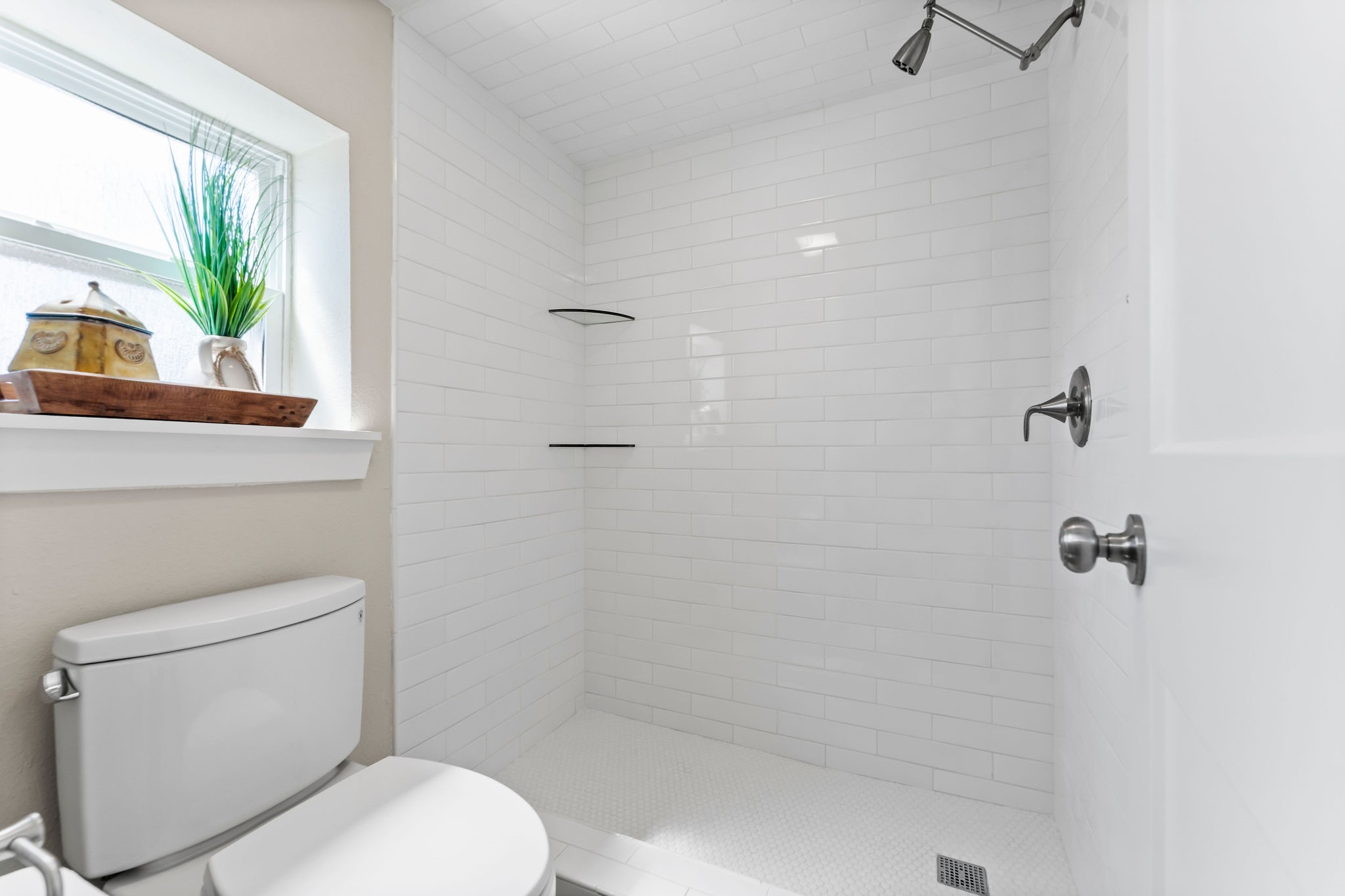 69 Lakeview Village Conroe, TX 77356 - Photo 30 of 50 a white toilet sitting next to a window