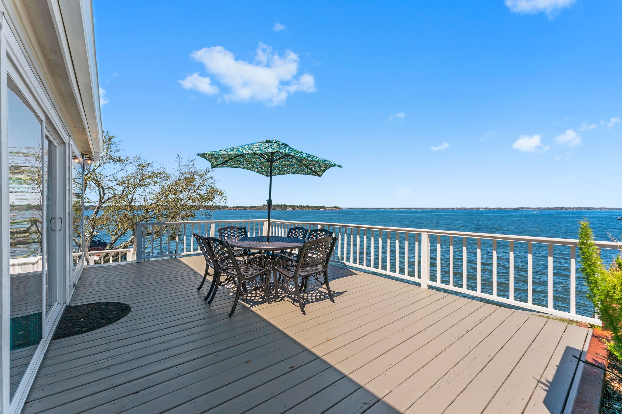 69 Lakeview Village Conroe, TX 77356 - Photo 31 of 50 a view of backyard with seating space and wooden floor