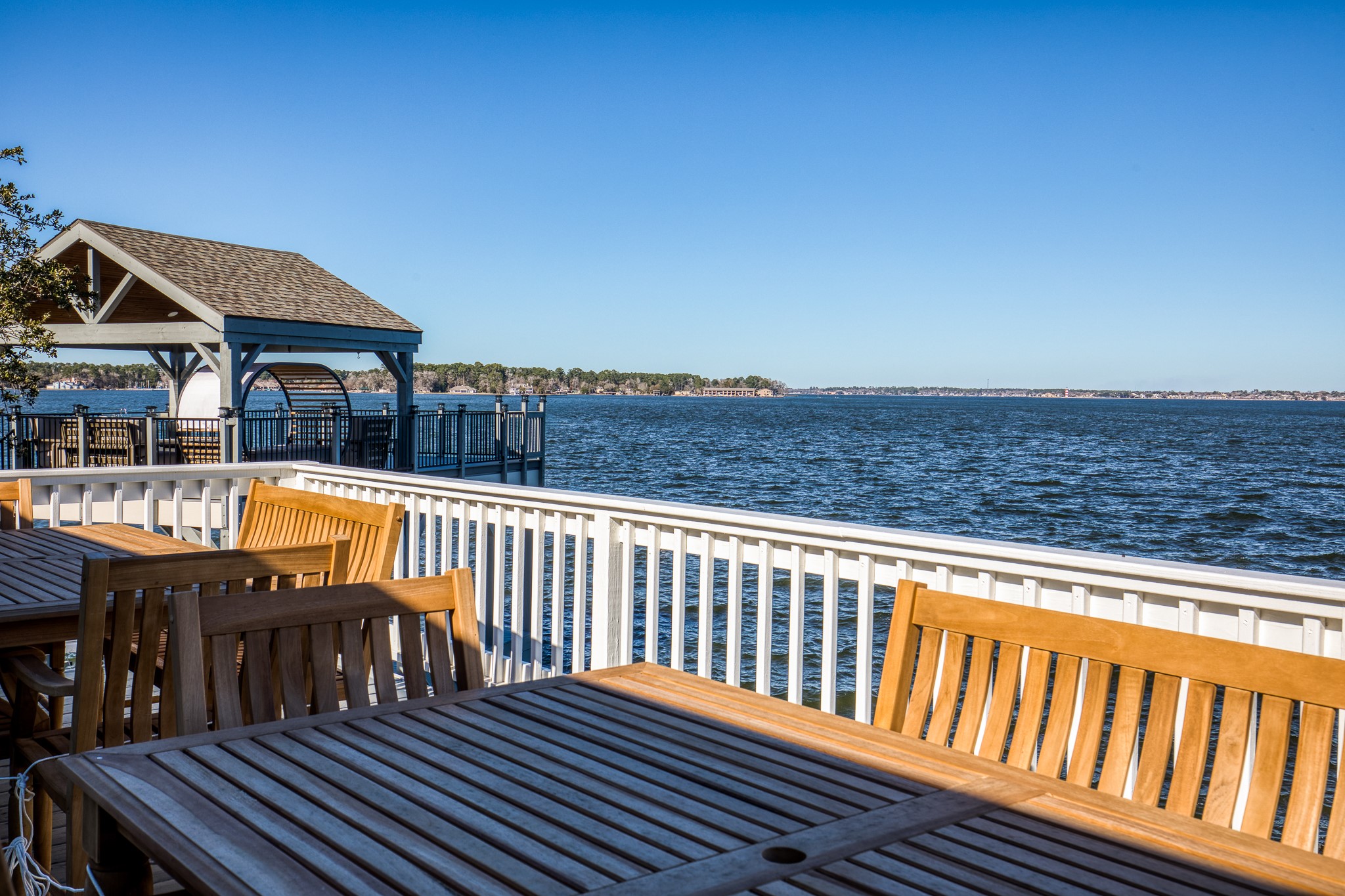 69 Lakeview Village Conroe, TX 77356 - Photo 32 of 50 a view of a roof deck with wooden floor and barbeque