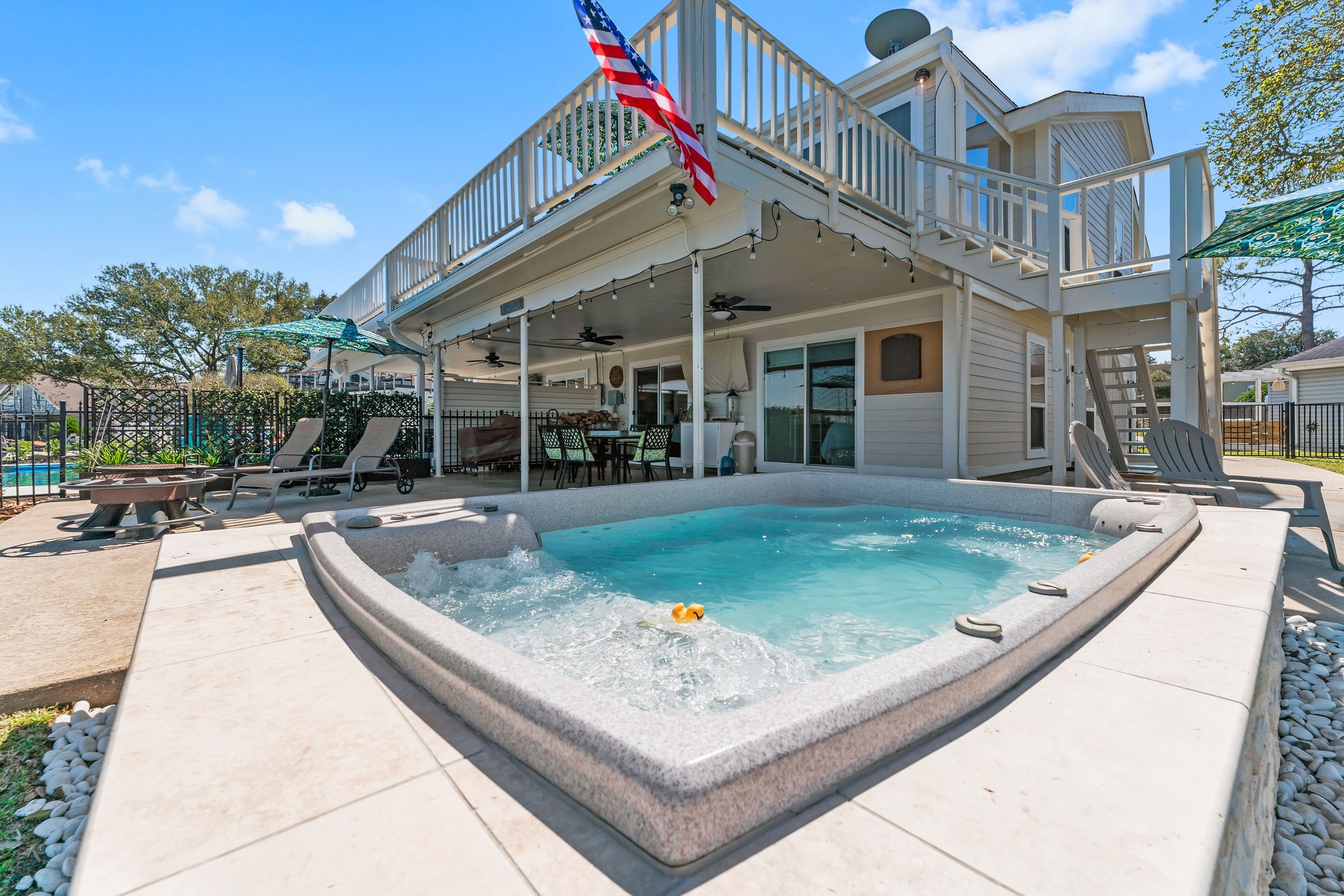 69 Lakeview Village Conroe, TX 77356 - Photo 36 of 50 a view of a house with backyard and sitting area