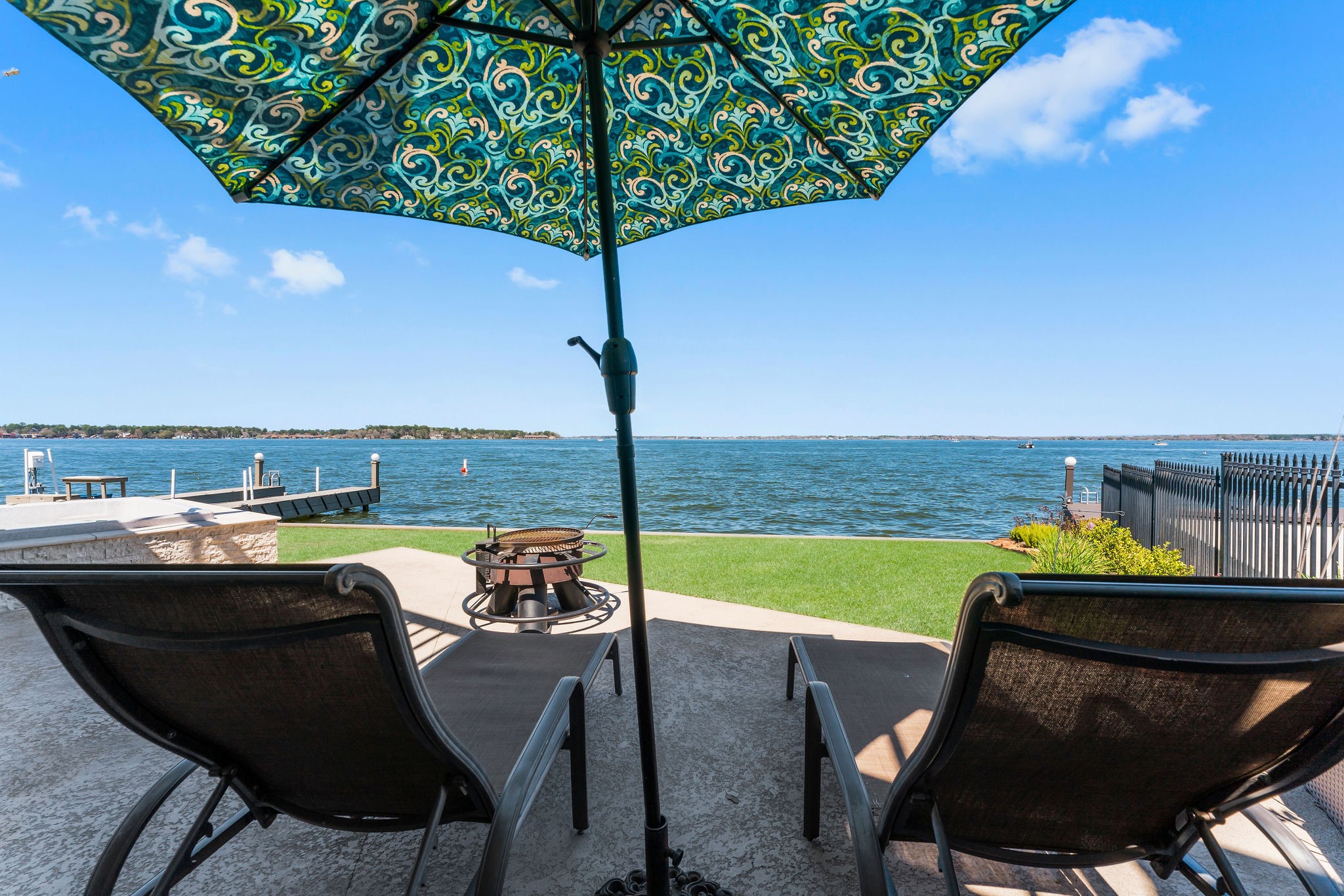 69 Lakeview Village Conroe, TX 77356 - Photo 45 of 50 a view of a ocean from a balcony with an outdoor seating
