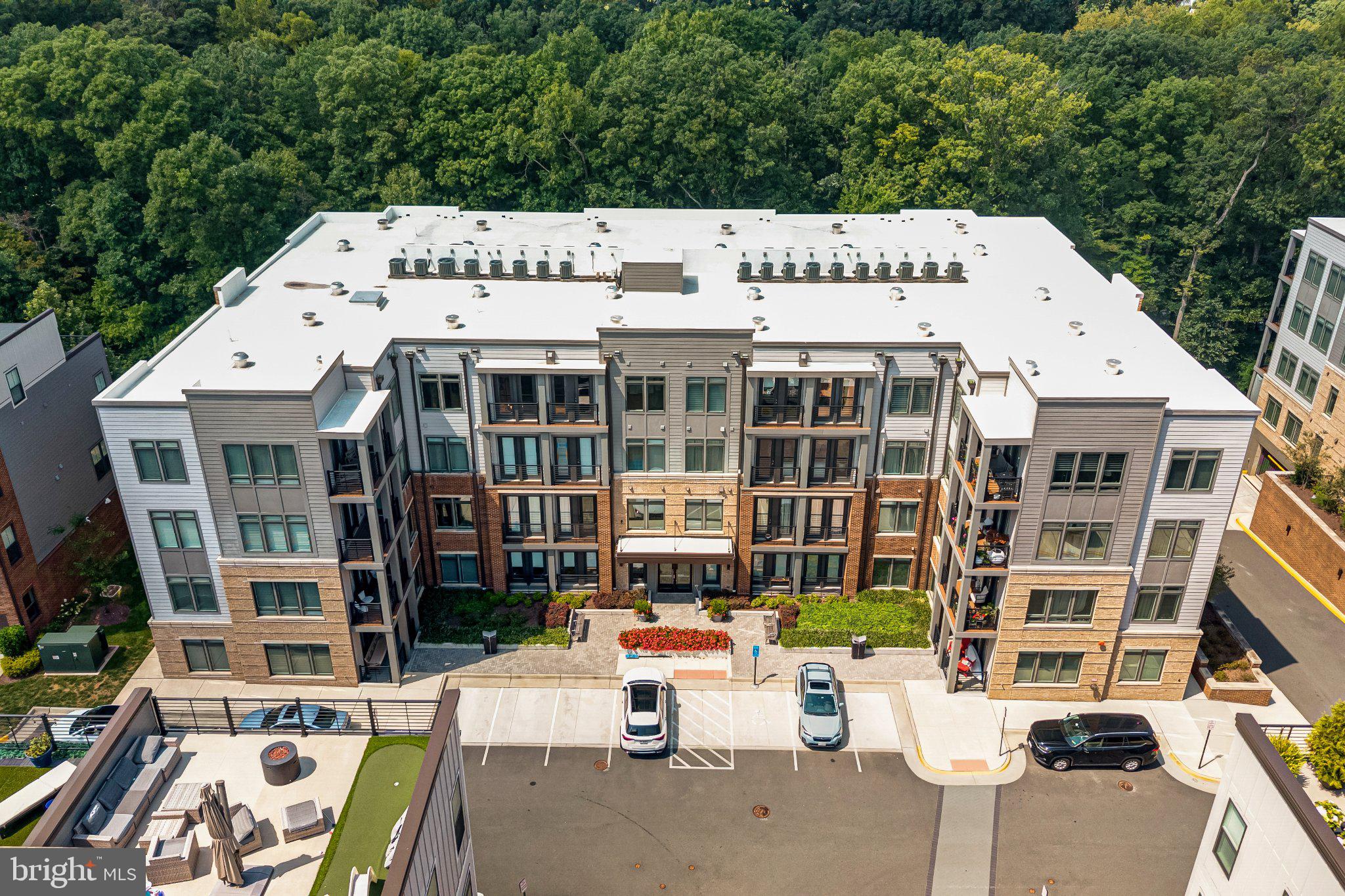 1669 Bandit Loop, Unit 103A Reston, VA 20190 - Photo 2 of 15 Front of the Condo Building backing to trees