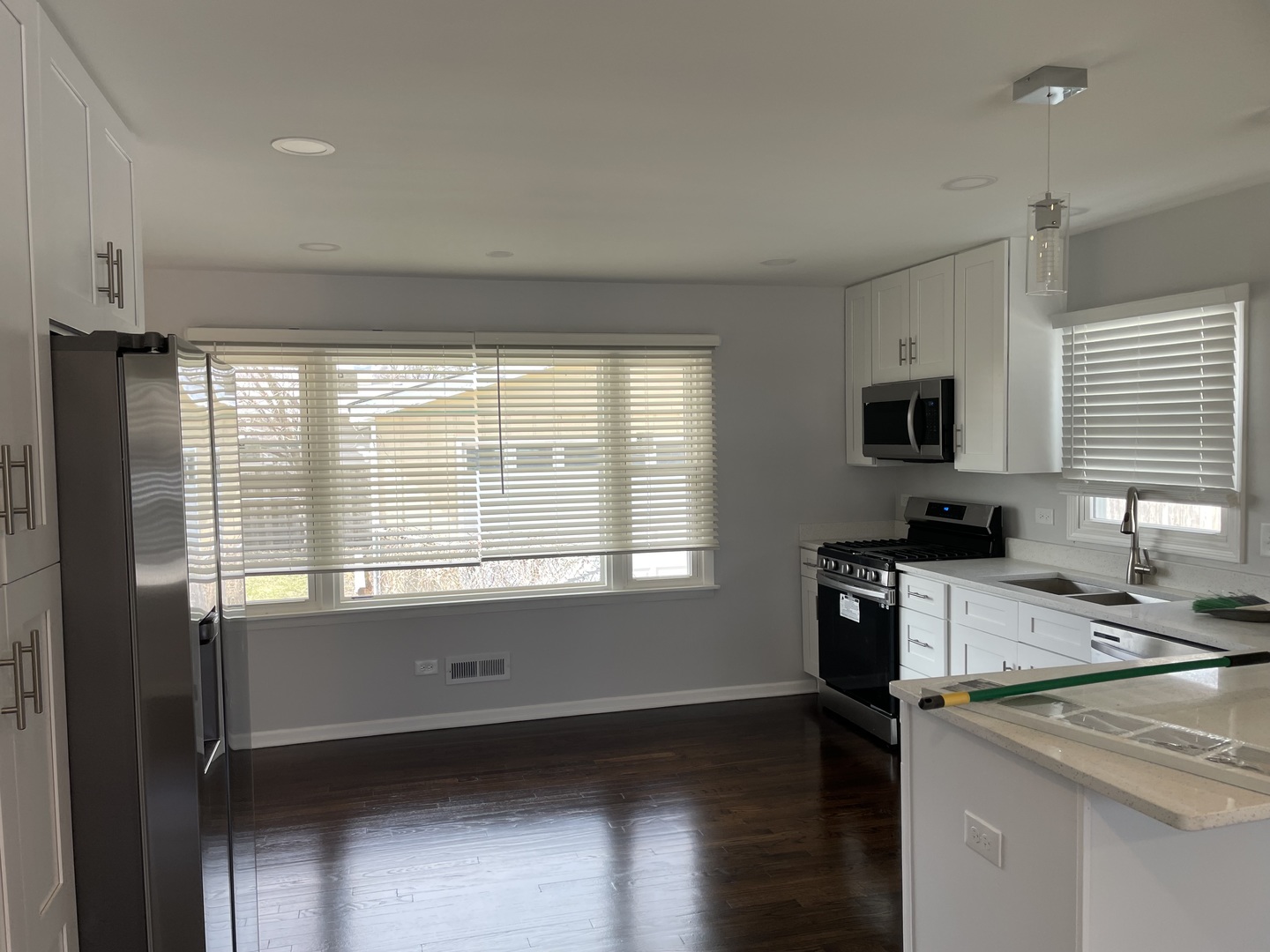 45 Arrowhead Drive Thornton, IL 60476 - Photo 3 of 11 a kitchen with a stove a sink and a microwave