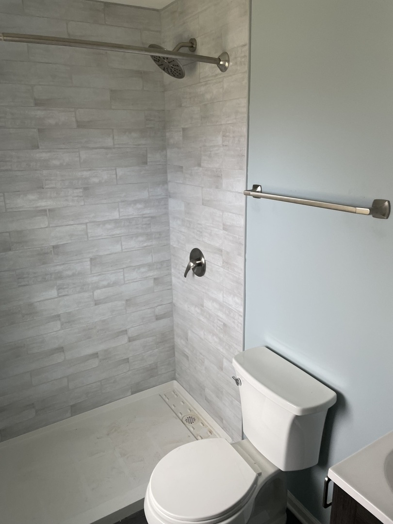 45 Arrowhead Drive Thornton, IL 60476 - Photo 8 of 11 a bathroom with a toilet and a shower