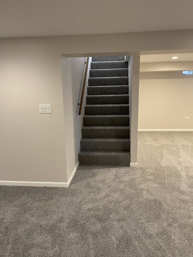 45 Arrowhead Drive Thornton, IL 60476 - Photo 10 of 11 a view of an empty room with stairs