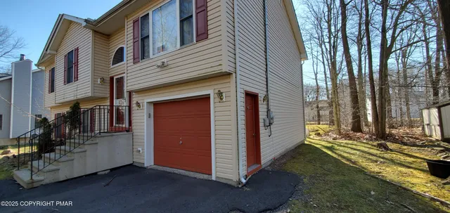 a living room with furniture and a gate