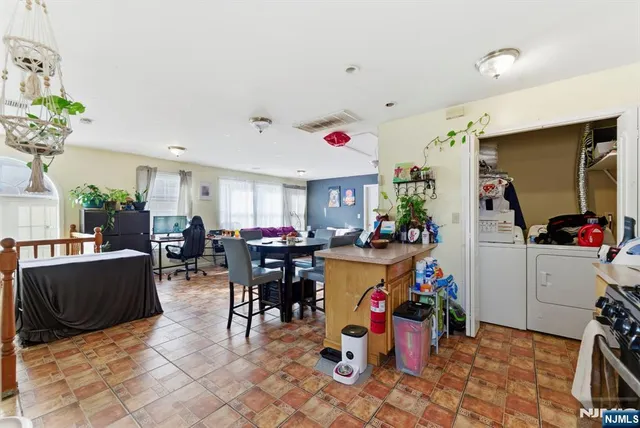 a view of a dining hall with lots of furniture and toys