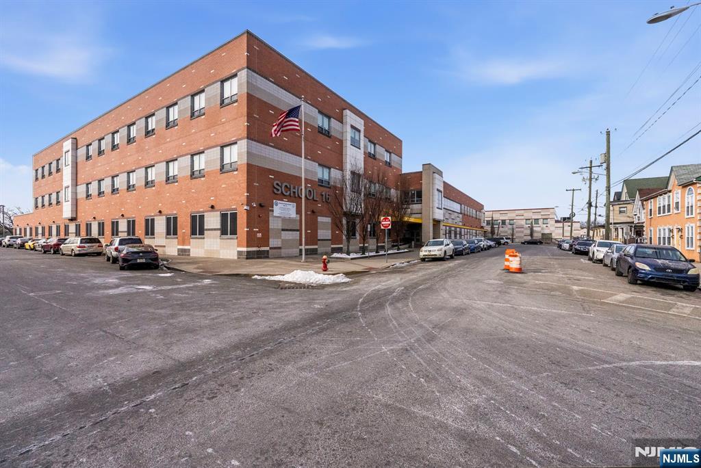 29-31 22nd Avenue Paterson, NJ 07513 - Photo 2 of 20 a view of building with cars parked