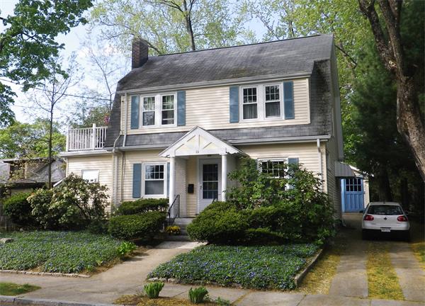 10 Niles Road Newton, MA 02461 - Photo 1 of 12 a front view of a house with a garden and plants