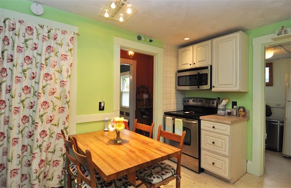 10 Niles Road Newton, MA 02461 - Photo 8 of 12 a kitchen with stainless steel appliances a stove a sink a microwave a refrigerator and cabinets