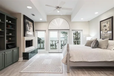 a bedroom with a large bed and a large window