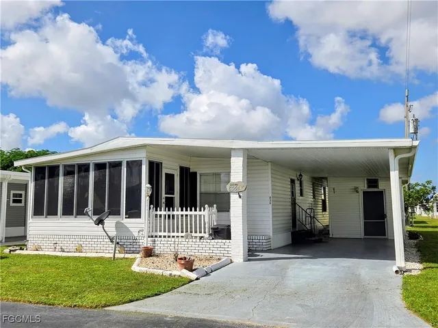a view of a house with a small yard