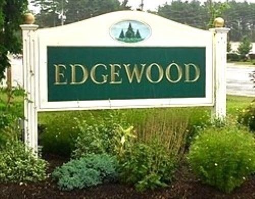 980 Plain Street, Unit 4 Marshfield, MA 02050 - Photo 1 of 26 a view of outdoor space with a garden and signage