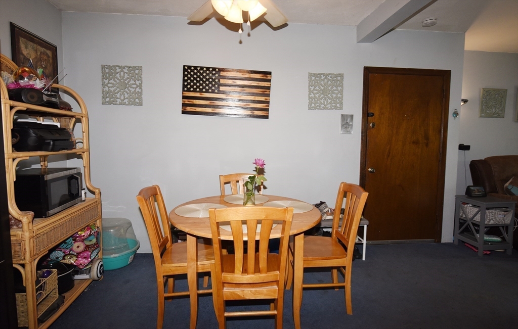 980 Plain Street, Unit 4 Marshfield, MA 02050 - Photo 11 of 26 a dining room with furniture and window