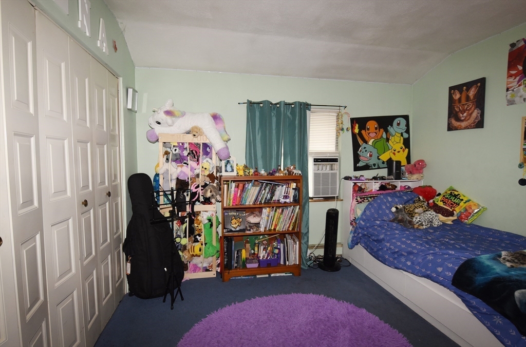 980 Plain Street, Unit 4 Marshfield, MA 02050 - Photo 15 of 26 a bed room with furniture and a window
