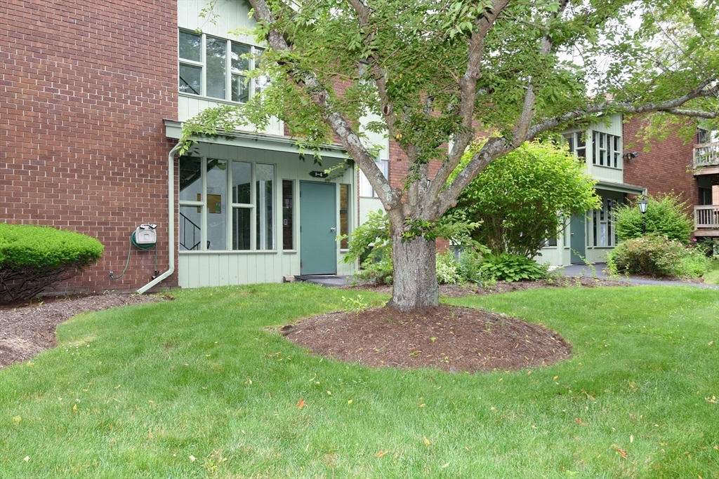980 Plain Street, Unit 4 Marshfield, MA 02050 - Photo 2 of 26 a view of a house with a garden
