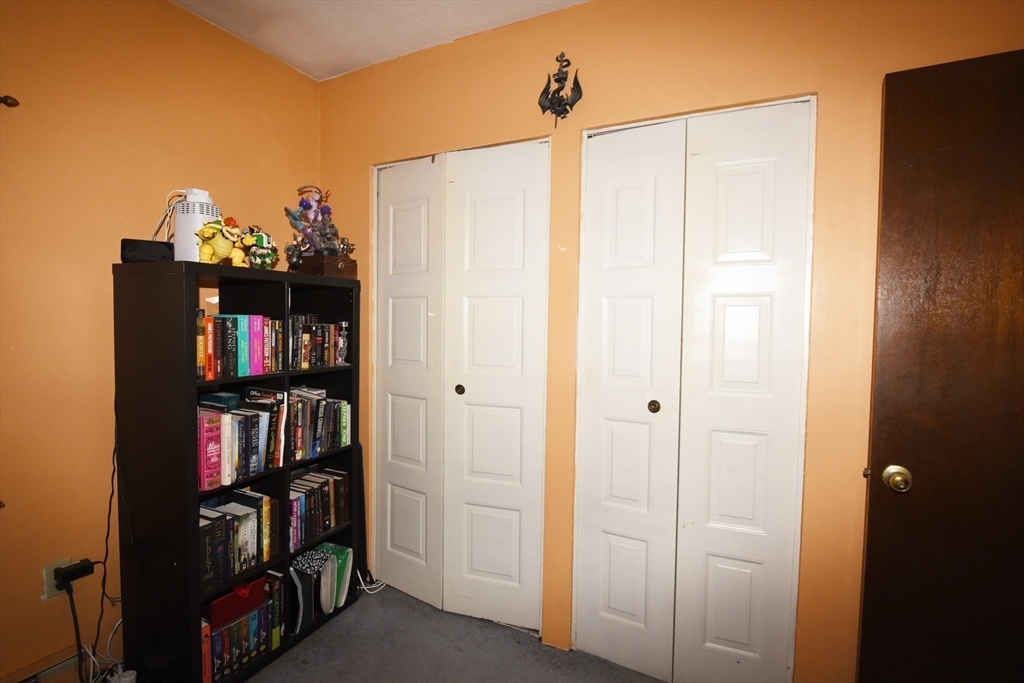 980 Plain Street, Unit 4 Marshfield, MA 02050 - Photo 21 of 26 a view of a bedroom with closet and bicycle