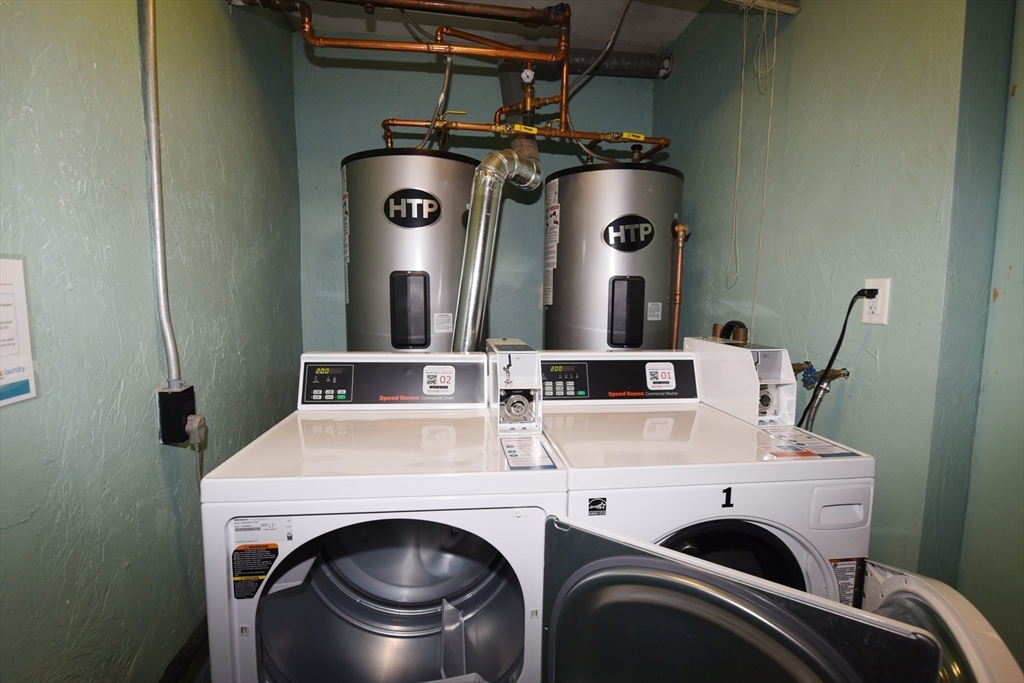 980 Plain Street, Unit 4 Marshfield, MA 02050 - Photo 26 of 26 a utility room with dryer and washer