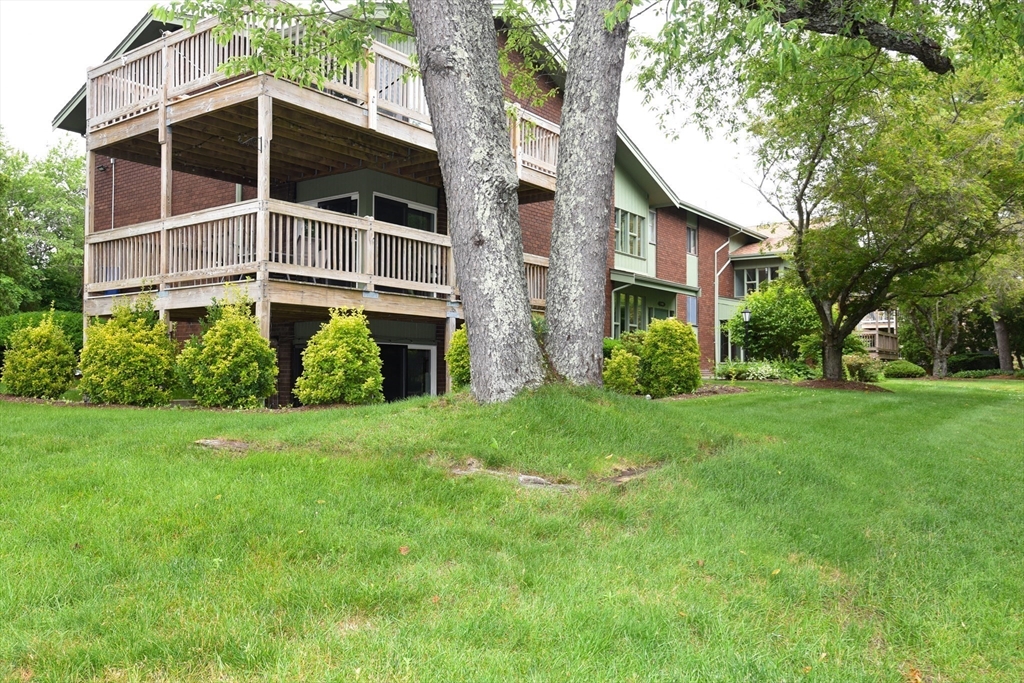 980 Plain Street, Unit 4 Marshfield, MA 02050 - Photo 3 of 26 a house view with a garden space