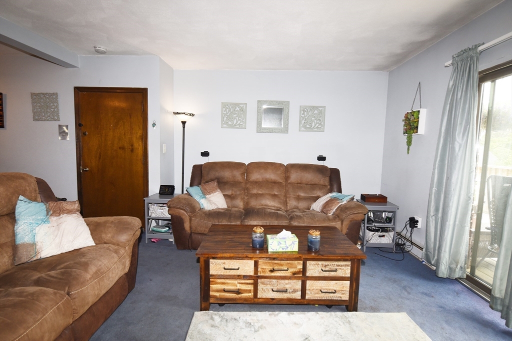 980 Plain Street, Unit 4 Marshfield, MA 02050 - Photo 5 of 26 a living room with furniture and a window
