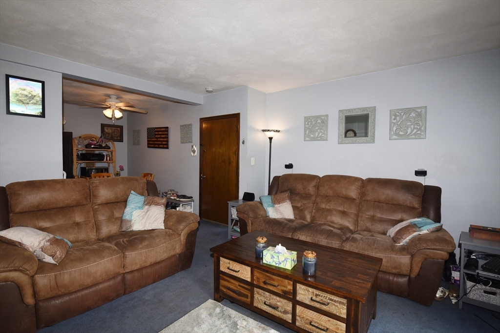 980 Plain Street, Unit 4 Marshfield, MA 02050 - Photo 6 of 26 a living room with furniture and a couch