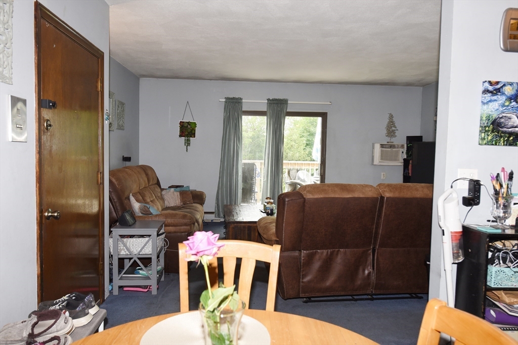 980 Plain Street, Unit 4 Marshfield, MA 02050 - Photo 10 of 26 a living room with furniture and wooden floor