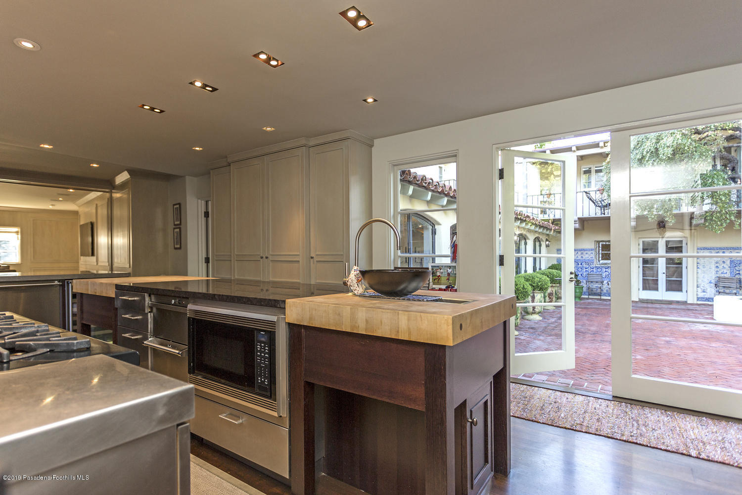 1130 Virginia Road San Marino, CA 91108 - Photo 12 of 55 a kitchen with a stove a sink and a refrigerator