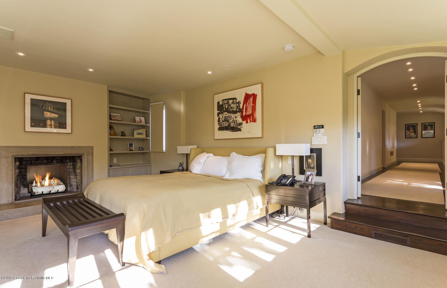 1130 Virginia Road San Marino, CA 91108 - Photo 19 of 55 a spacious bedroom with a bed and a fireplace