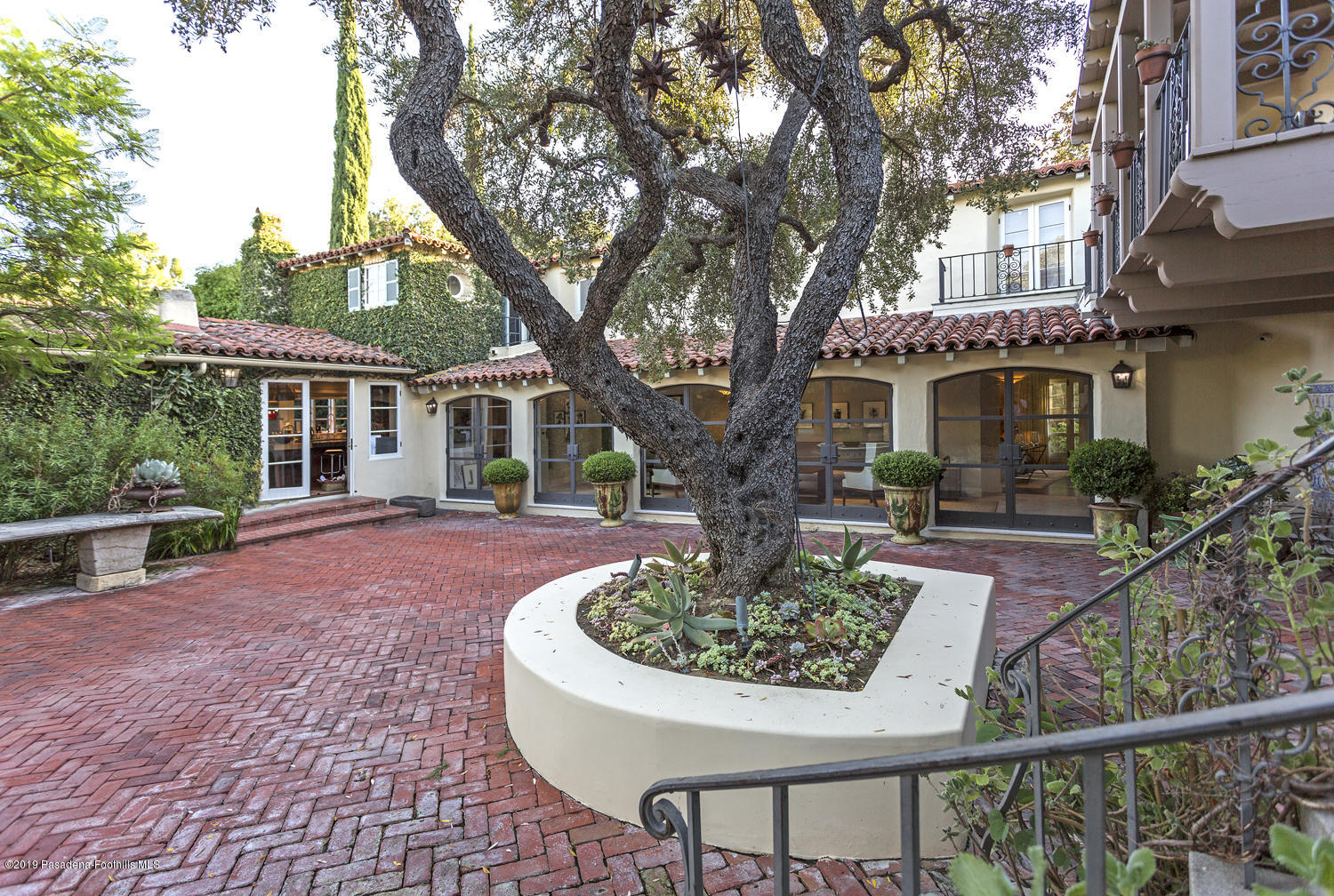 1130 Virginia Road San Marino, CA 91108 - Photo 25 of 55 a house that has a tree in front of it