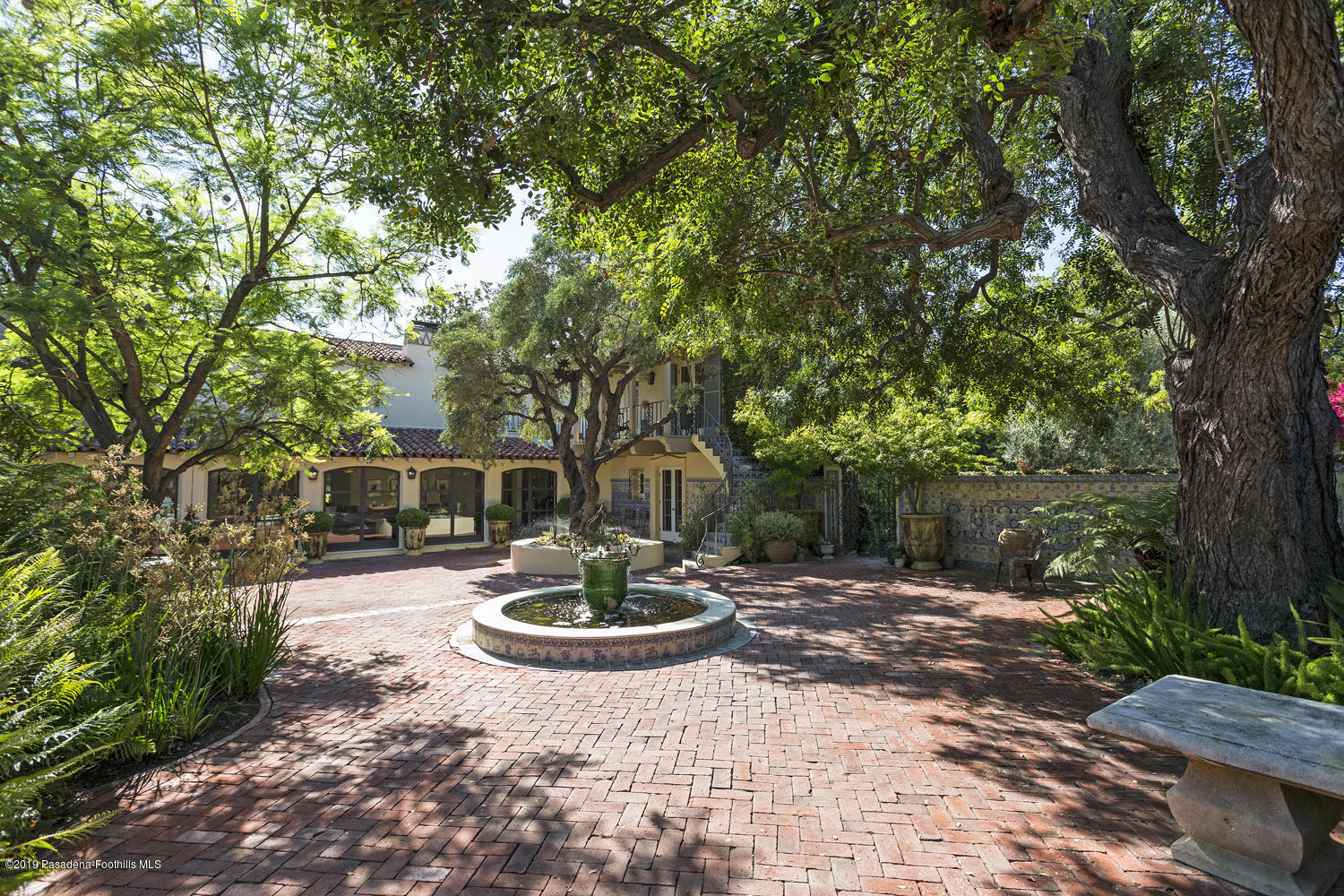 1130 Virginia Road San Marino, CA 91108 - Photo 26 of 55 a front view of a house with garden and patio