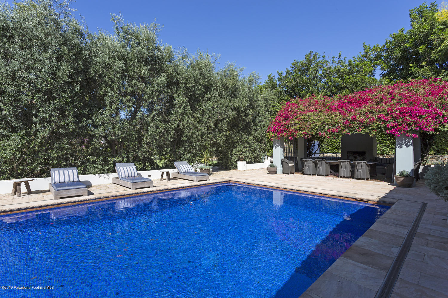 1130 Virginia Road San Marino, CA 91108 - Photo 31 of 55 a view of a swimming pool with a patio