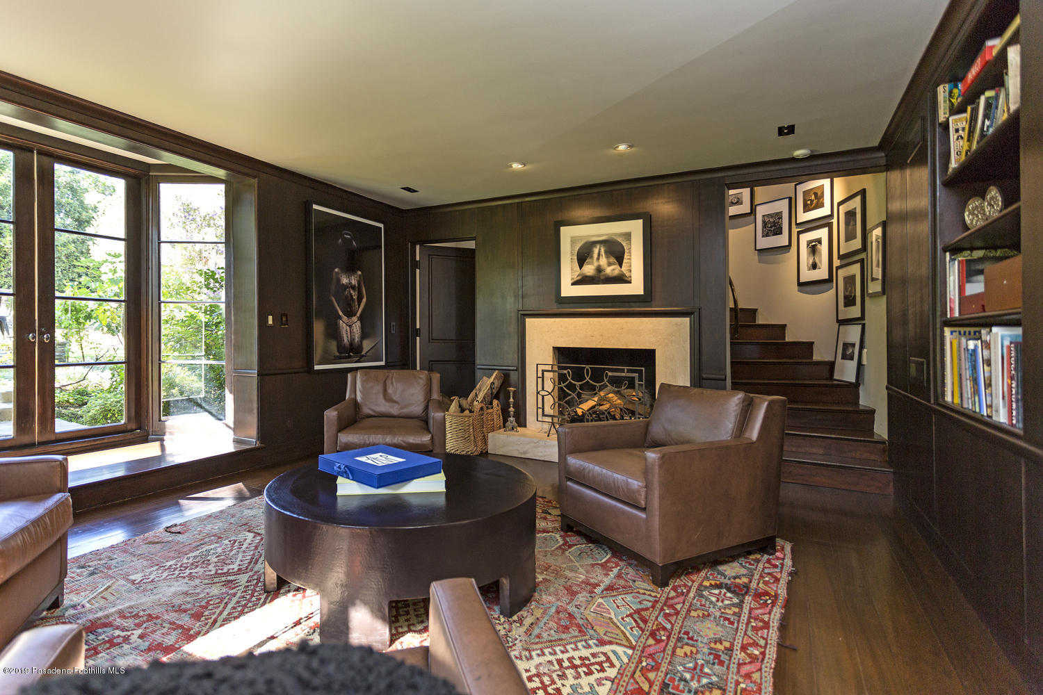 1130 Virginia Road San Marino, CA 91108 - Photo 8 of 55 a living room with furniture and a fireplace