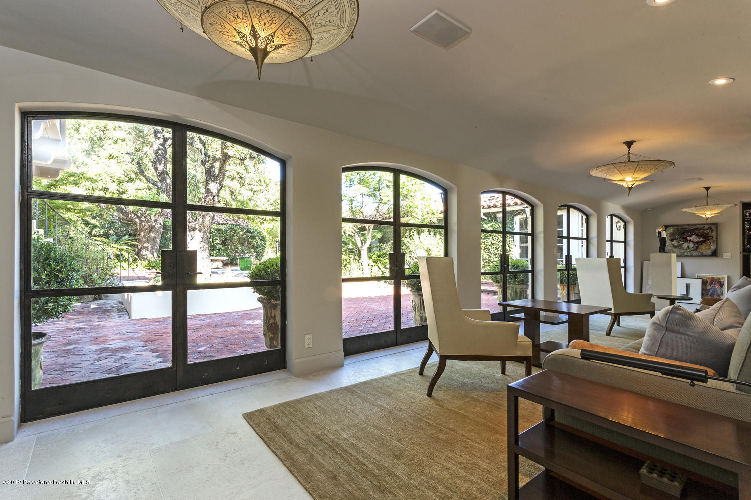 1130 Virginia Road San Marino, CA 91108 - Photo 10 of 55 a living room with furniture and a floor to ceiling window