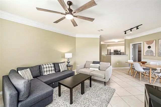 a living room with fireplace furniture and a flat screen tv