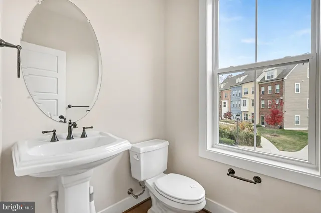 a bathroom with a sink a toilet and tub