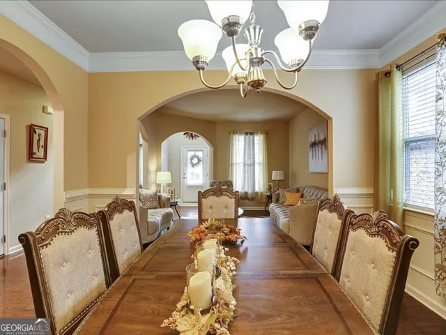 a large kitchen with stainless steel appliances granite countertop a sink and a stove