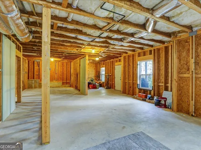 a view of a room with wooden walls
