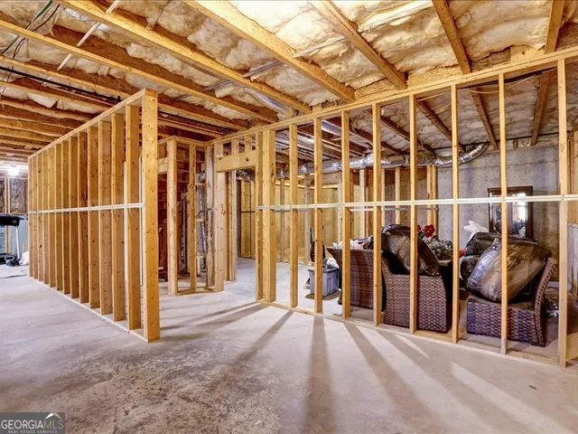 a view of a porch with a table and chairs