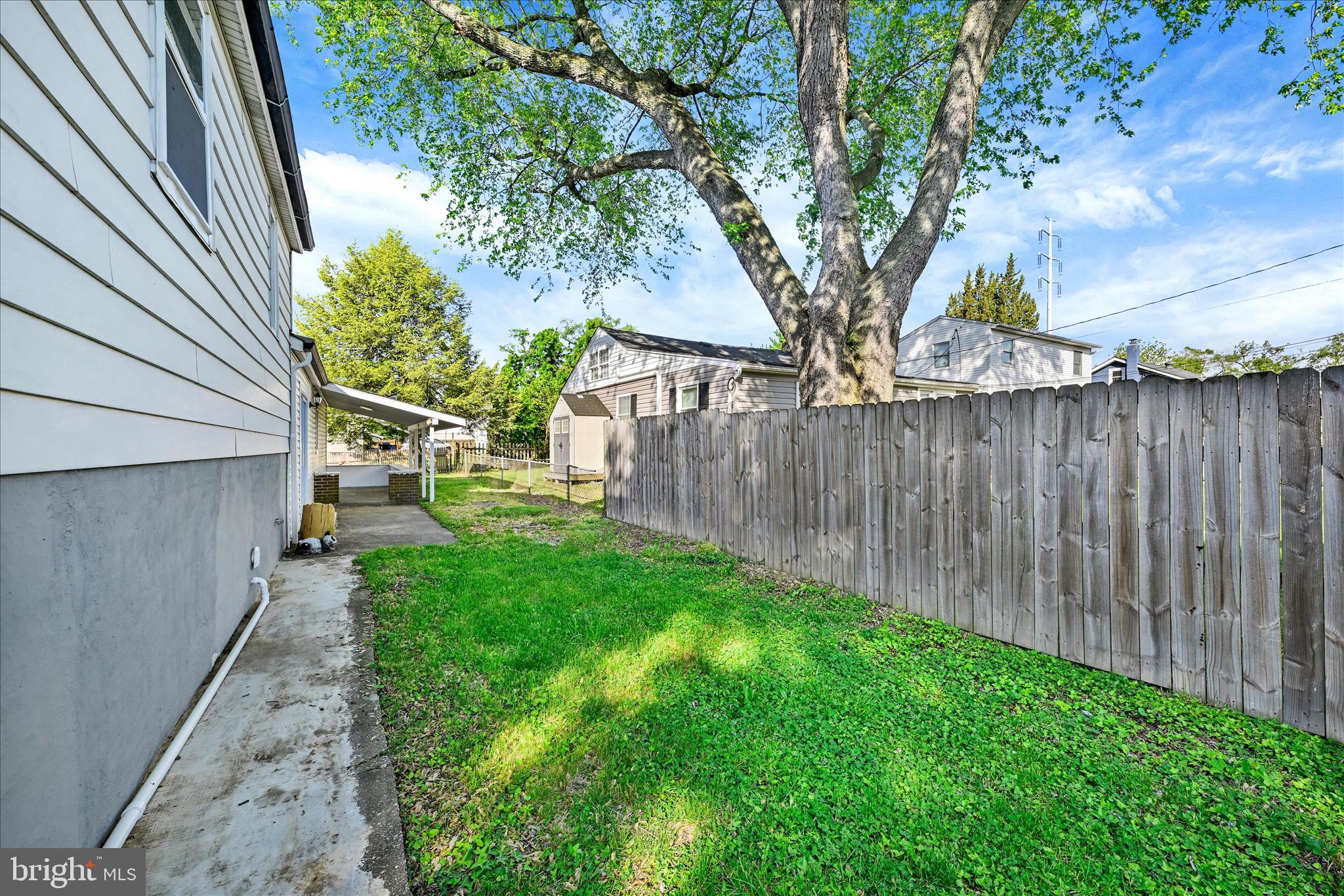 2 Armor Court Baltimore, MD 21220 - Photo 27 of 33 a view of backyard with wooden fence and a large tree